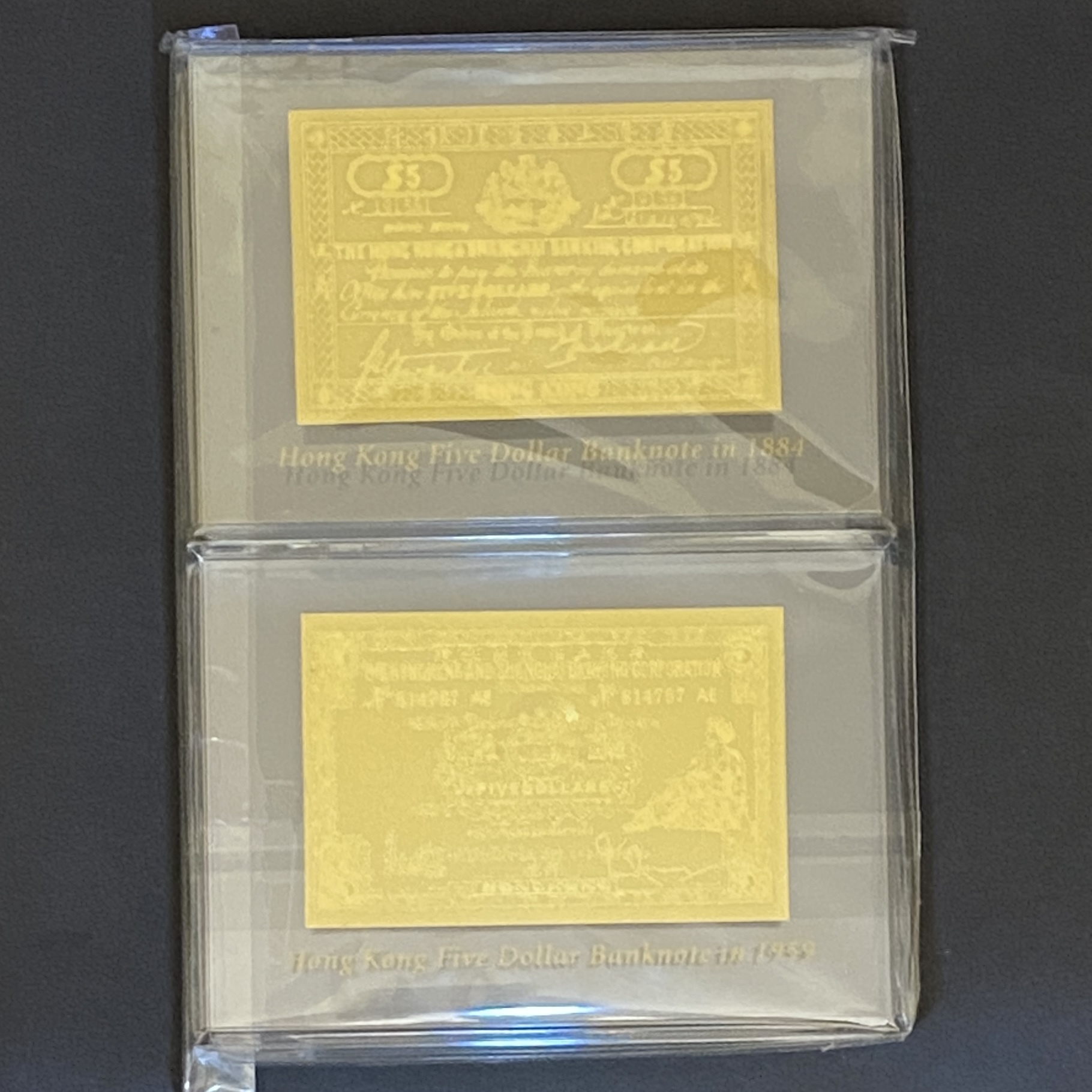 HSBC bank gold paperweight set of 2 (1884 five dollars and 1959 five dollars)