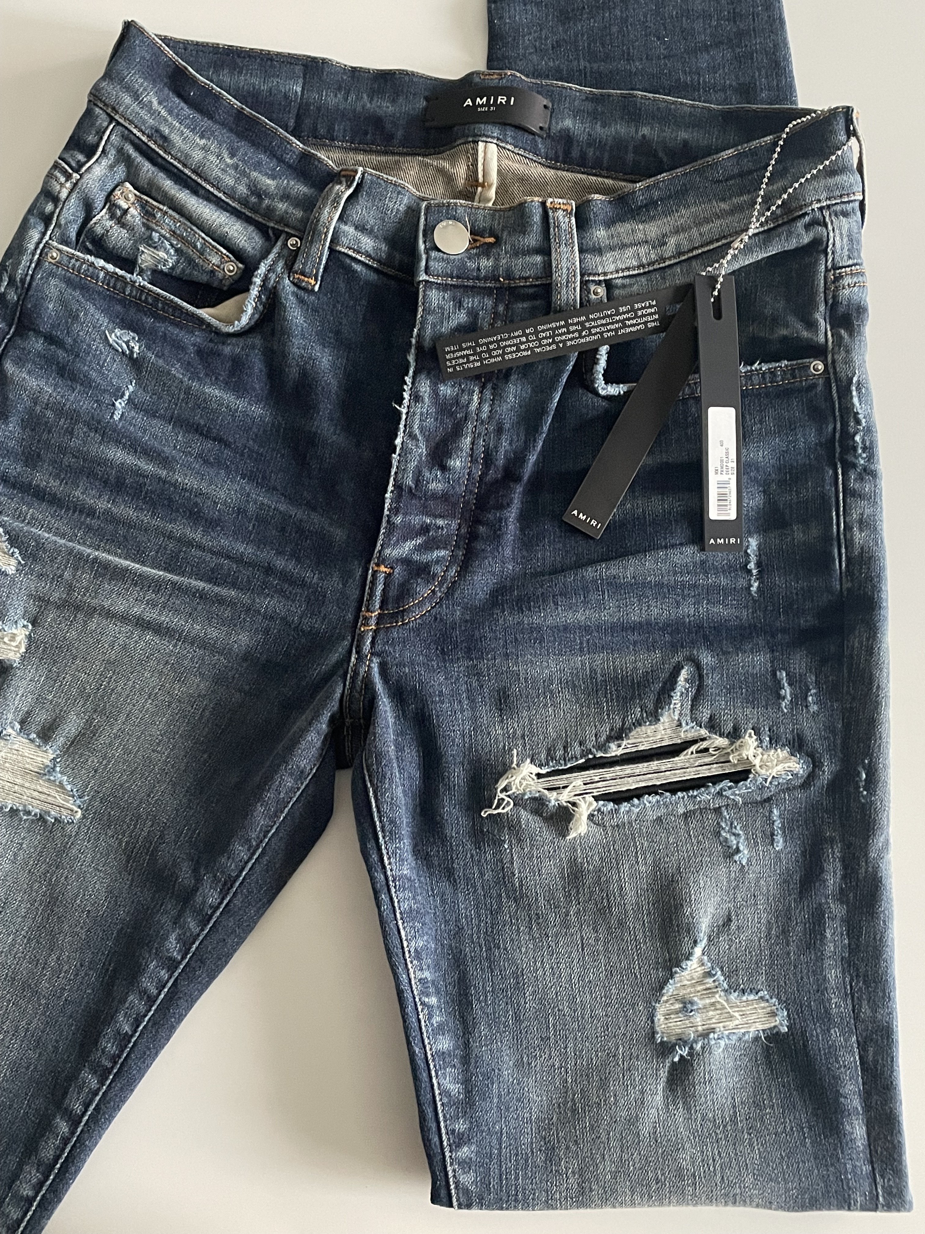 AMIRI  刷破接皮革  牛仔褲