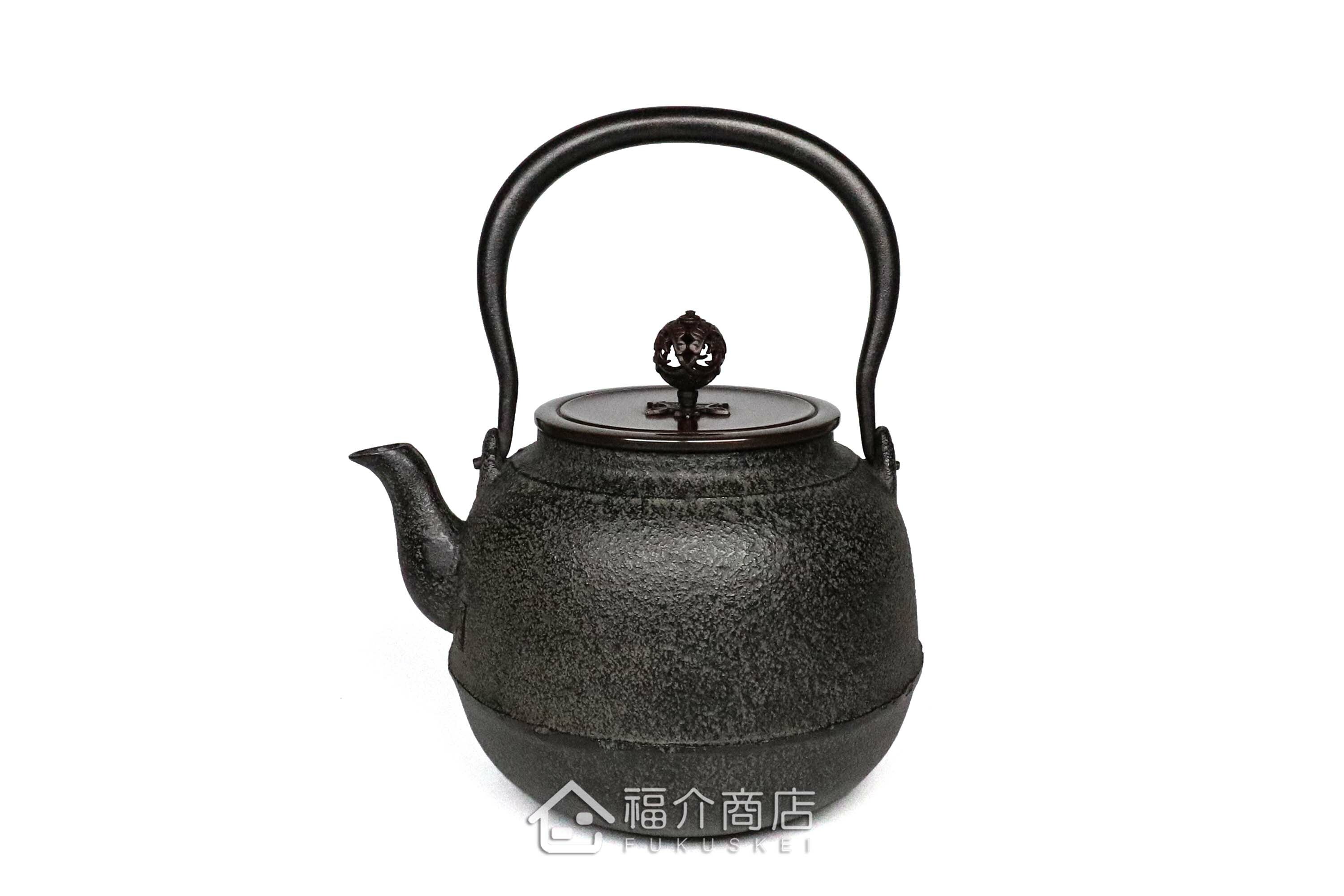 煮水泡茶用的銅蓋鐵壺，壺身象嵌鯉魚紋