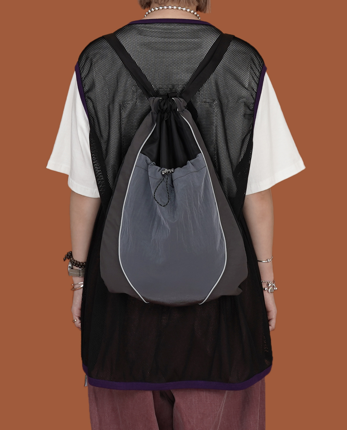 滑料縮口反光壓條背包