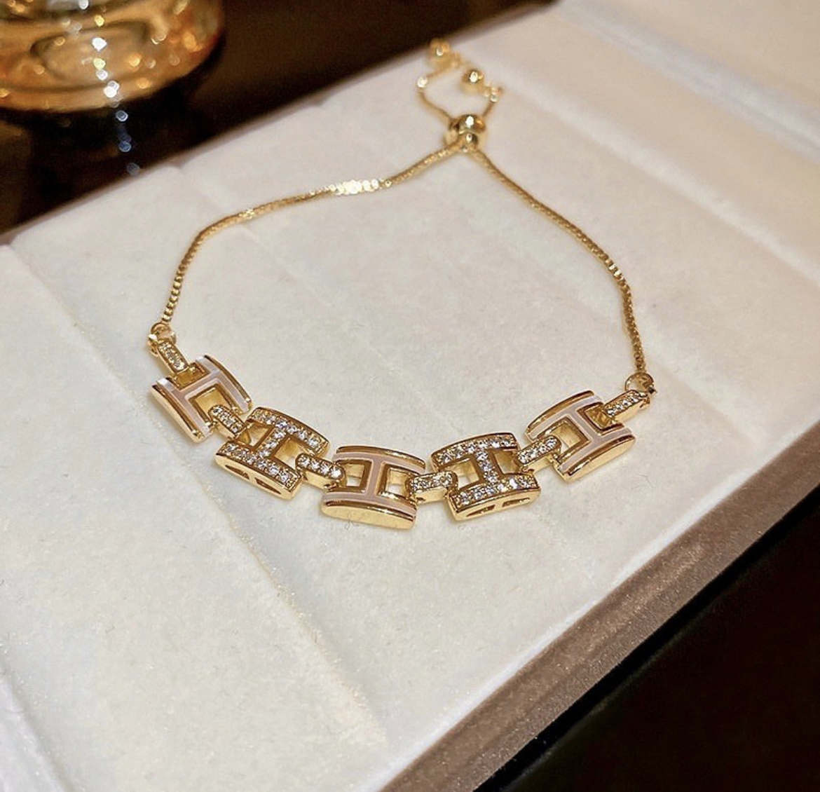 H晶透白玉貝 橫金珠抽拉手鍊