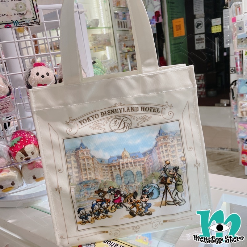 米奇與朋友手挽袋