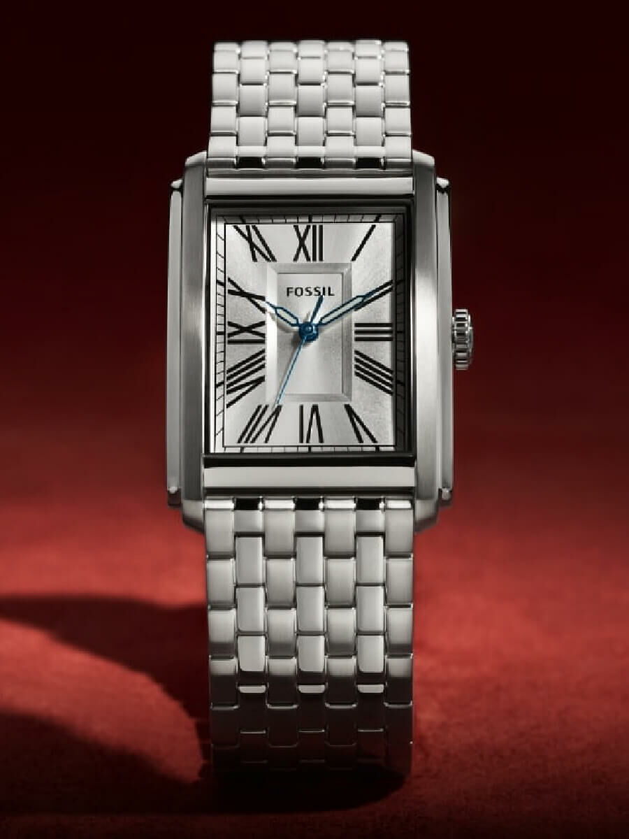A silver-tone Carraway watch.