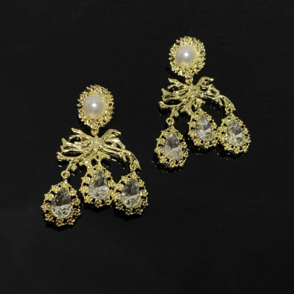 Golden-colored earrings