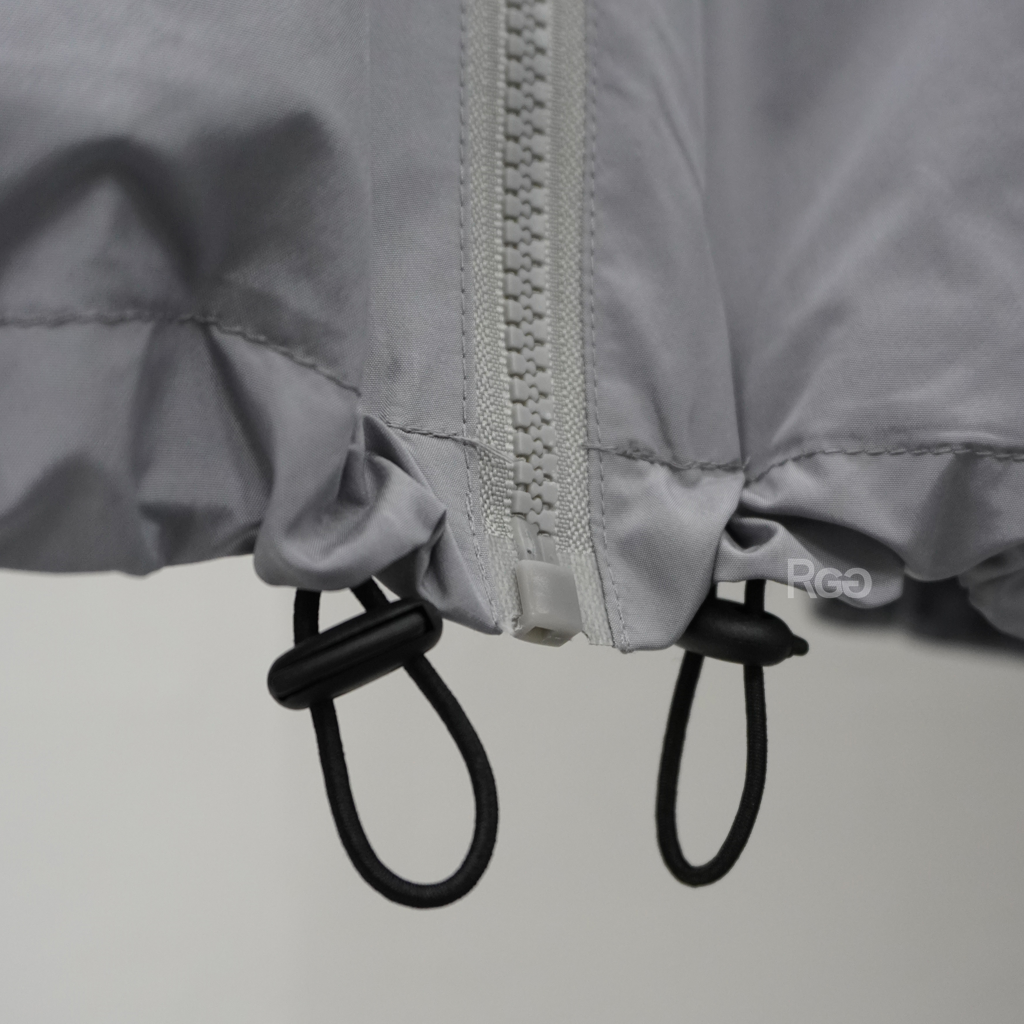 出芽拼接尼龍套裝下擺抽繩細節