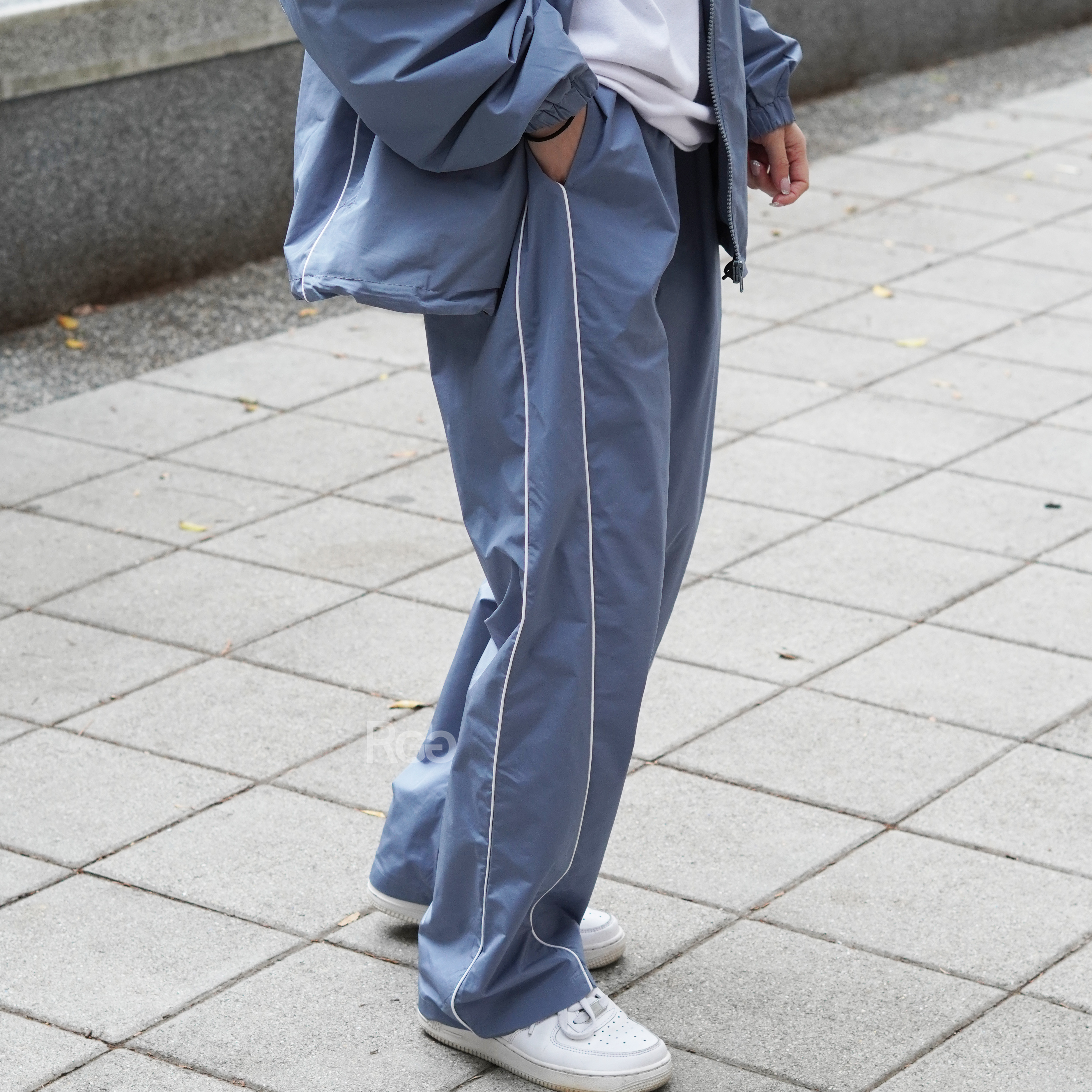 女模著出芽拼接尼龍套裝褲子淺藍Ｍ