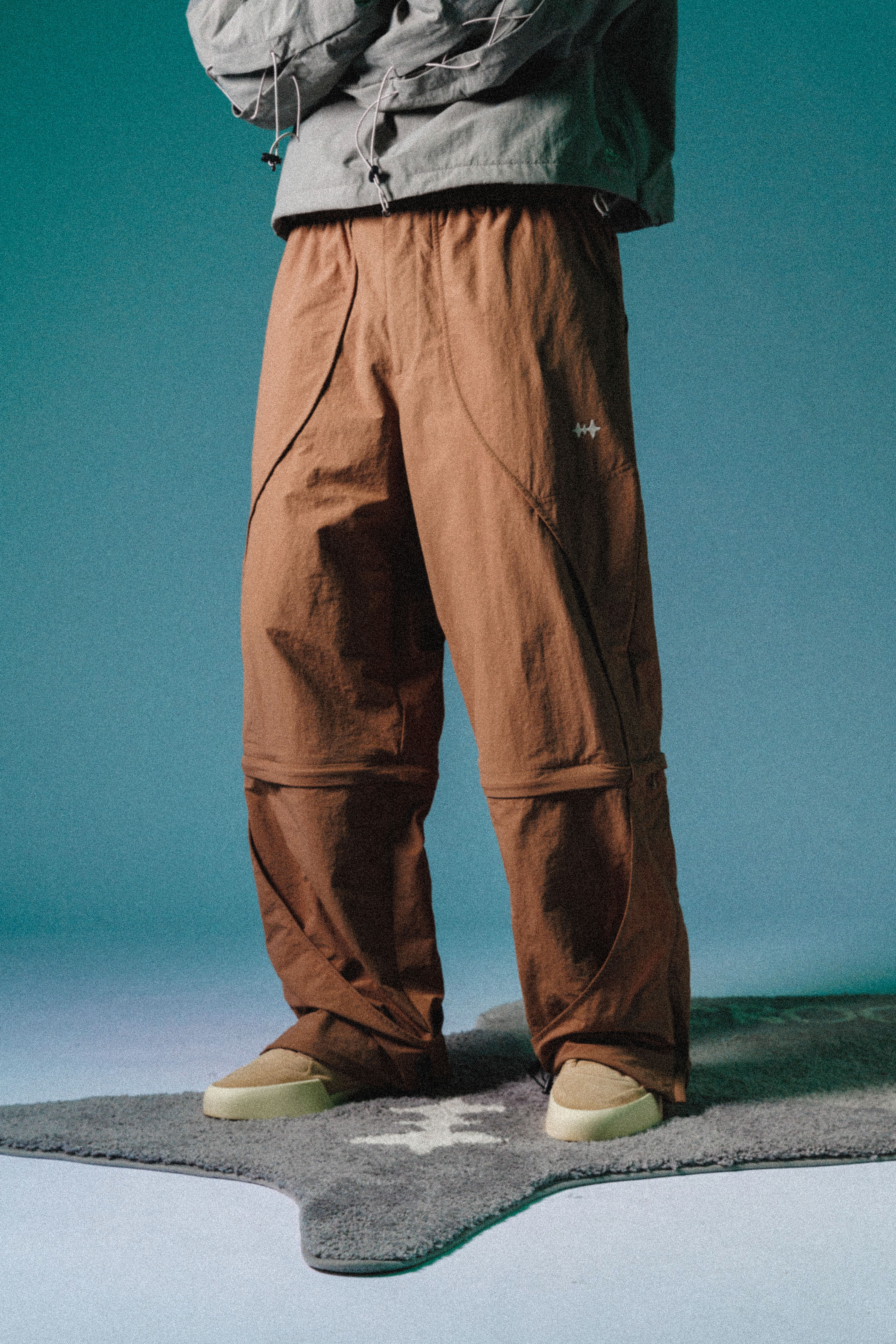 2-WAY NYLON CURVED PANTS - KHAKI