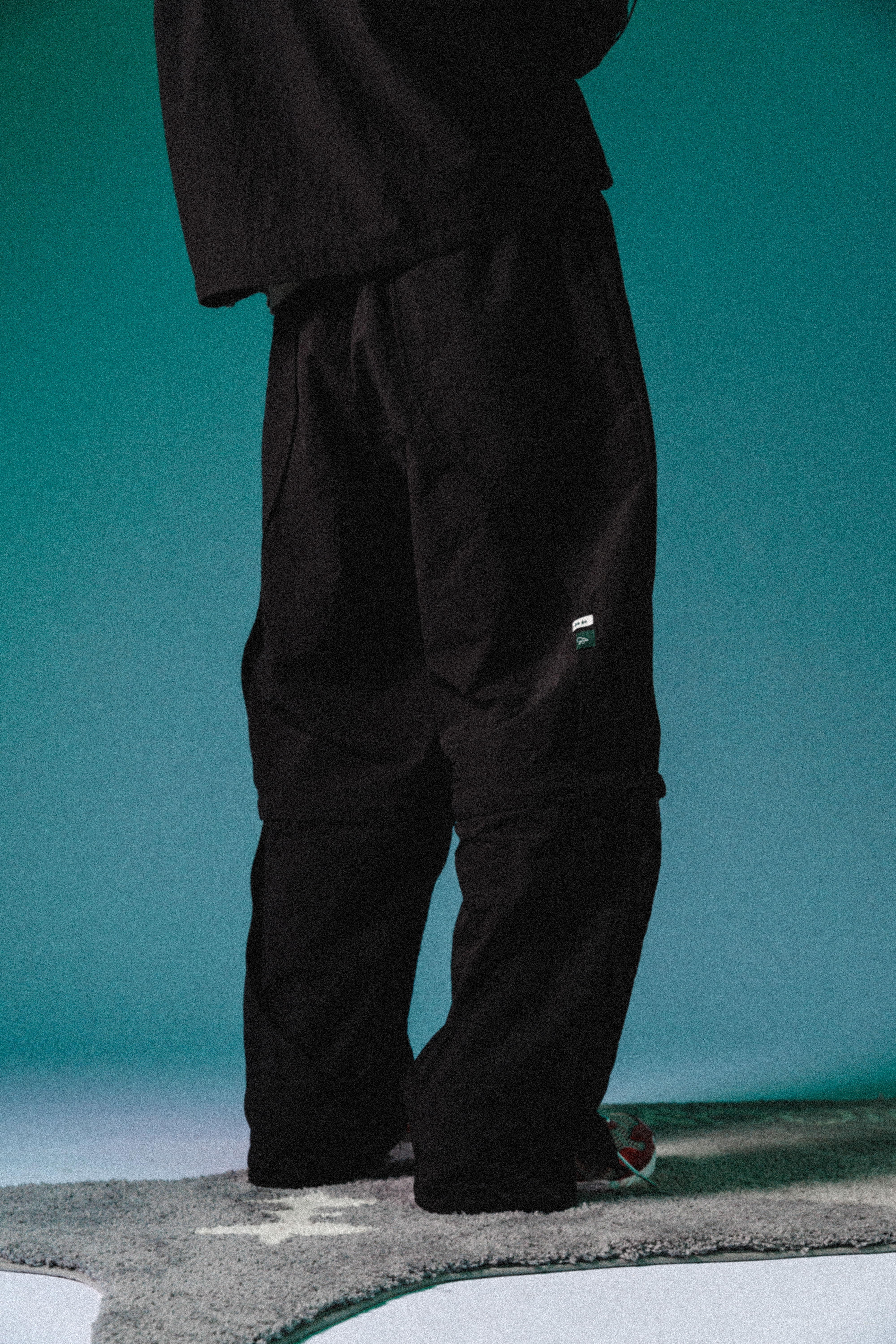 2-WAY NYLON CURVED PANTS - BLACK