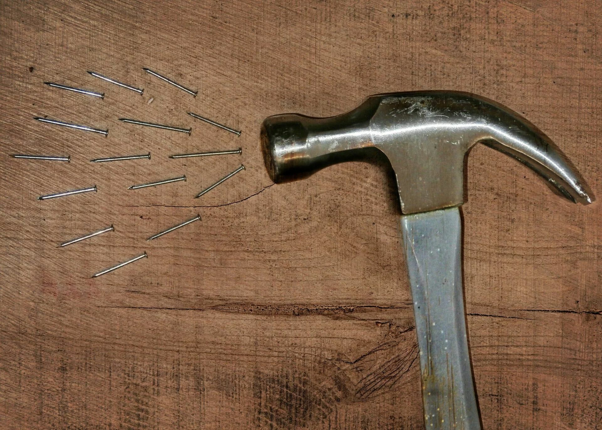 hammer and nails on wood board