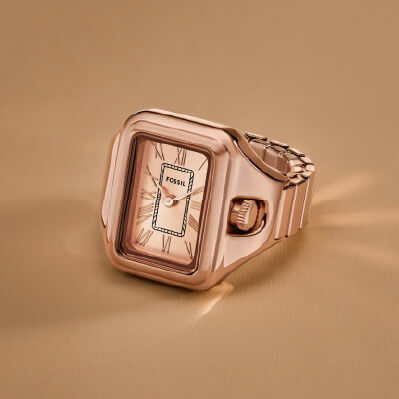 A rose gold-tone watch ring.