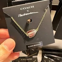 [S] COACH CL230 X TOM WESSELMANN LIPS PENDANT SLIDER BRACELET,GOLD/RED, 889295544167 (SCO691)