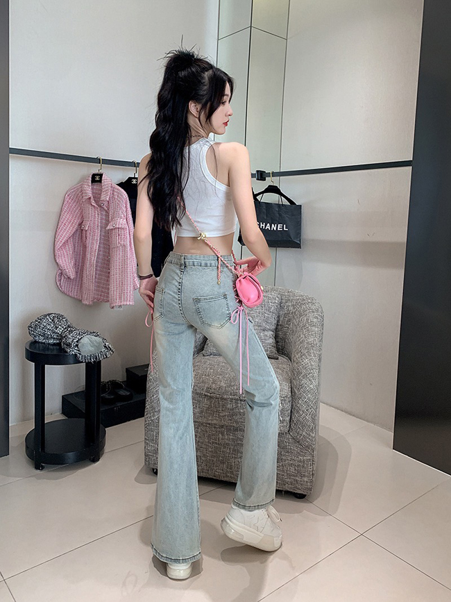 側邊蝴蝶結鬚鬚造型小喇叭牛仔褲-一色