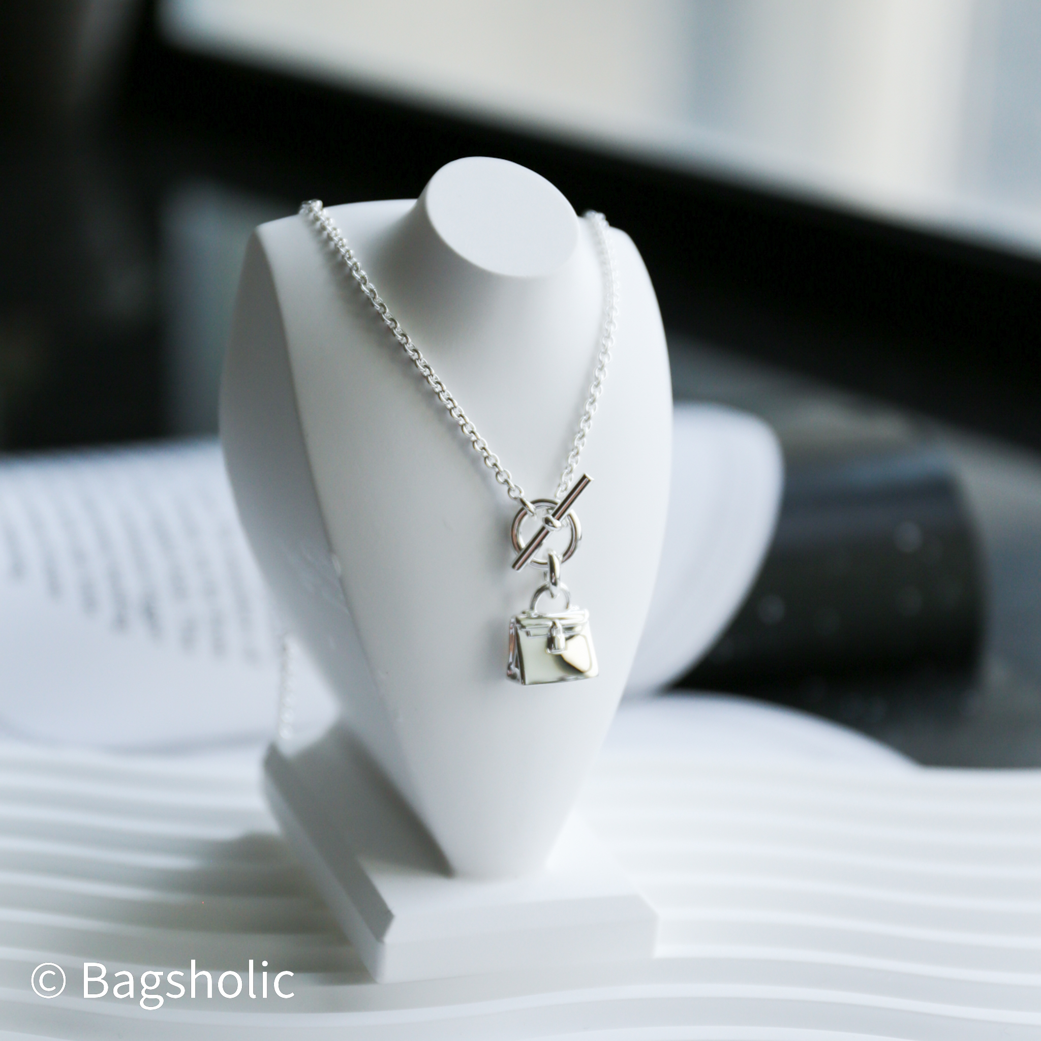 Hermes Amulettes Kelly pendant