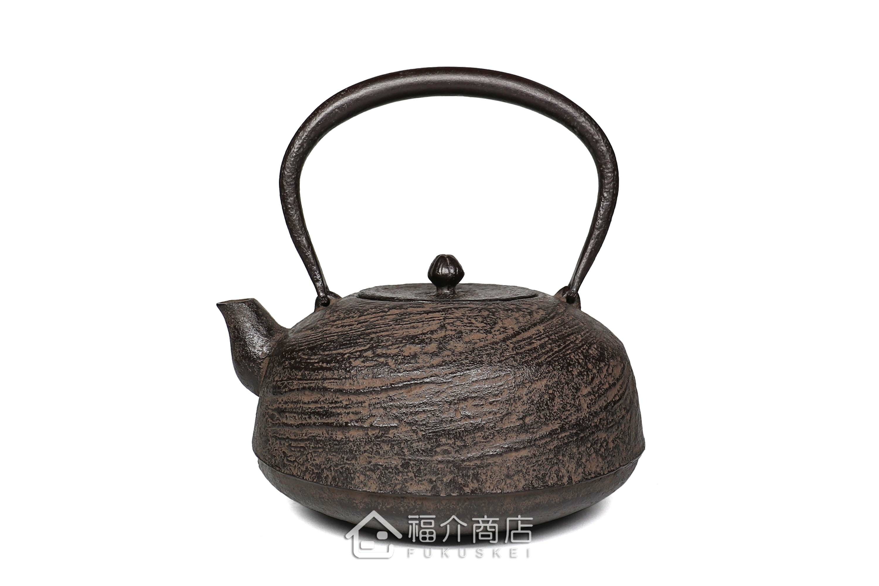 及川榮喜所製作煮水泡茶用的鐵壺,壺身有水流紋飾