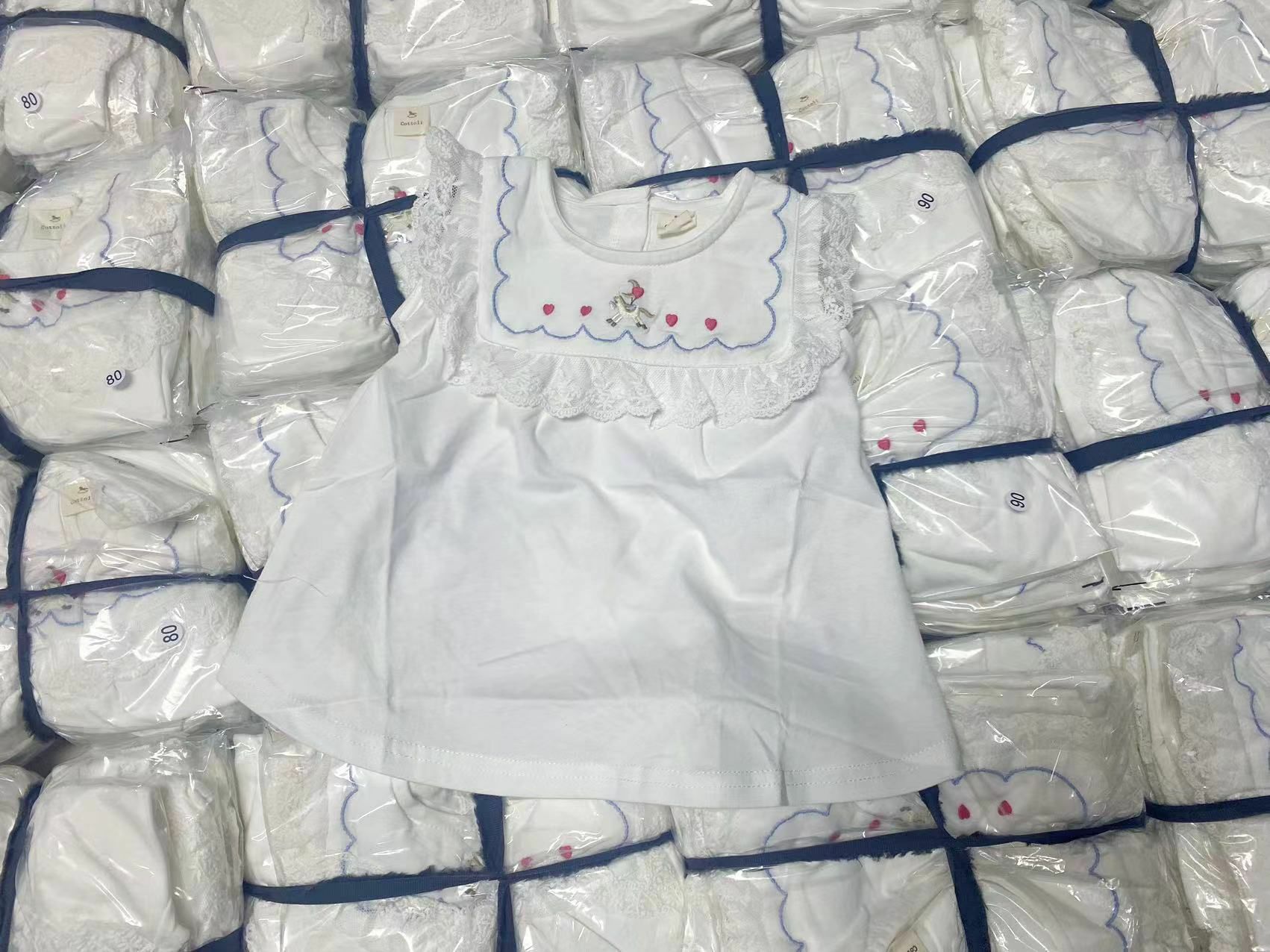 日單 Cottoli蕾絲裙擺上衣