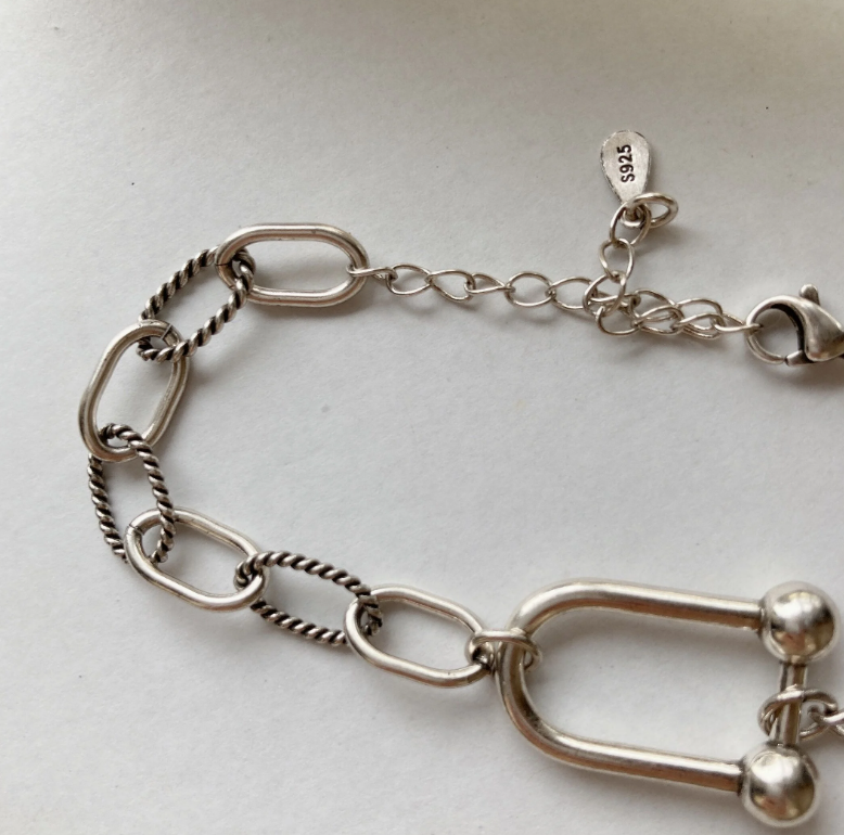 [LAUGHTER] Karabiner chain bracelet