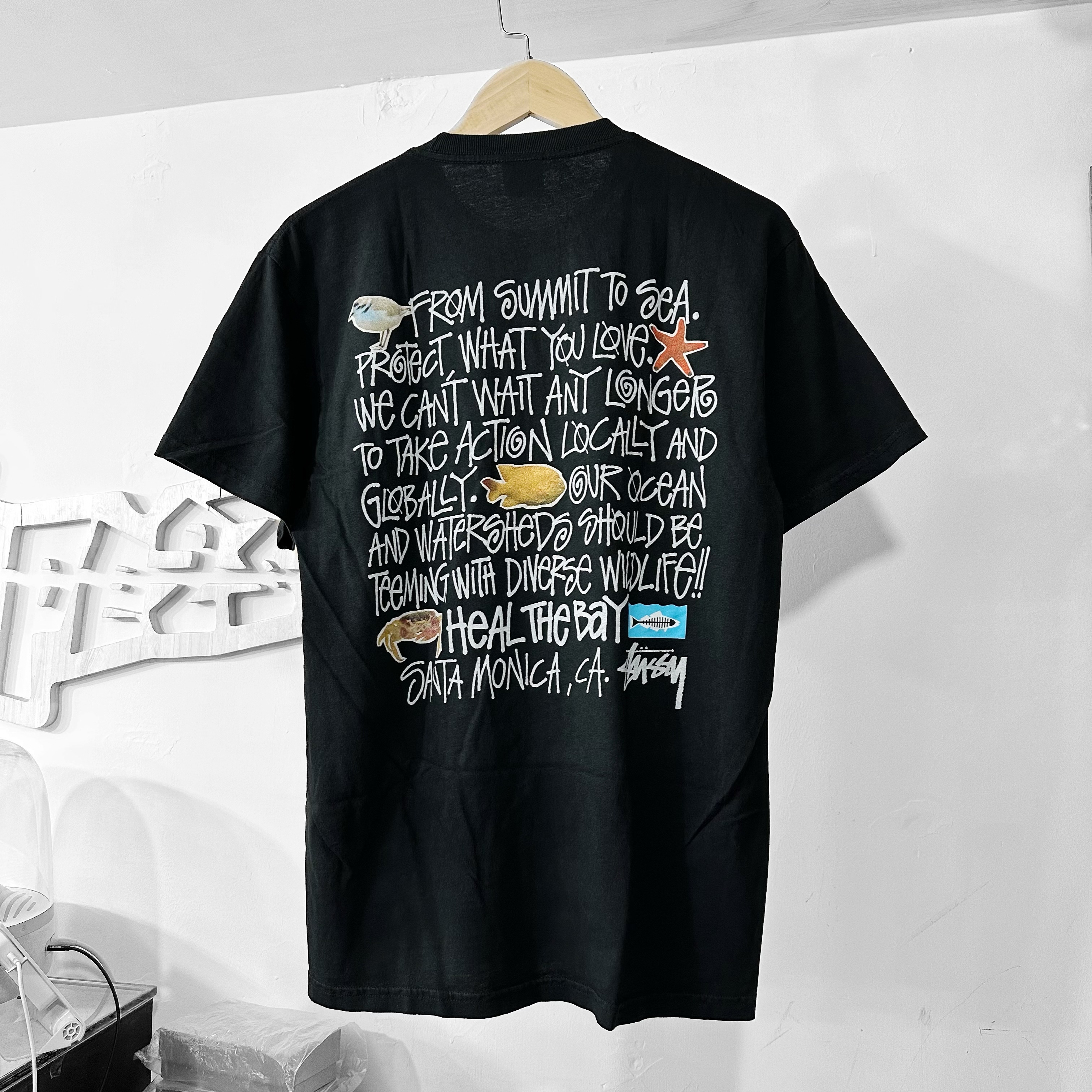 STUSSY X HEAL THE BAY SUMMIT TO SEA TEE PIGMENT DYED BLACK