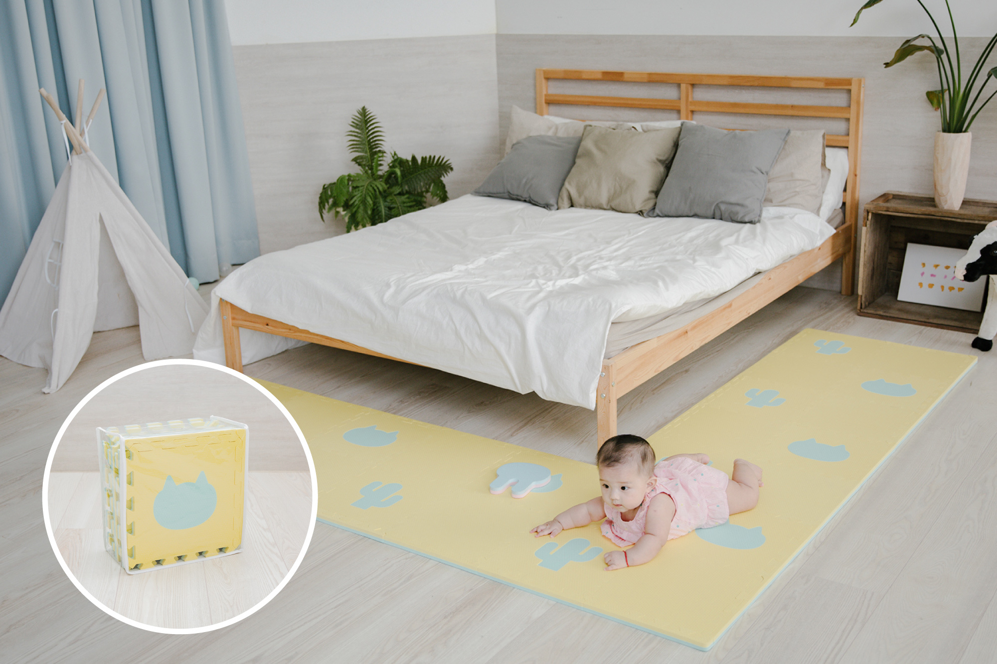 這是一張寶寶趴在遊戲地墊上的照片