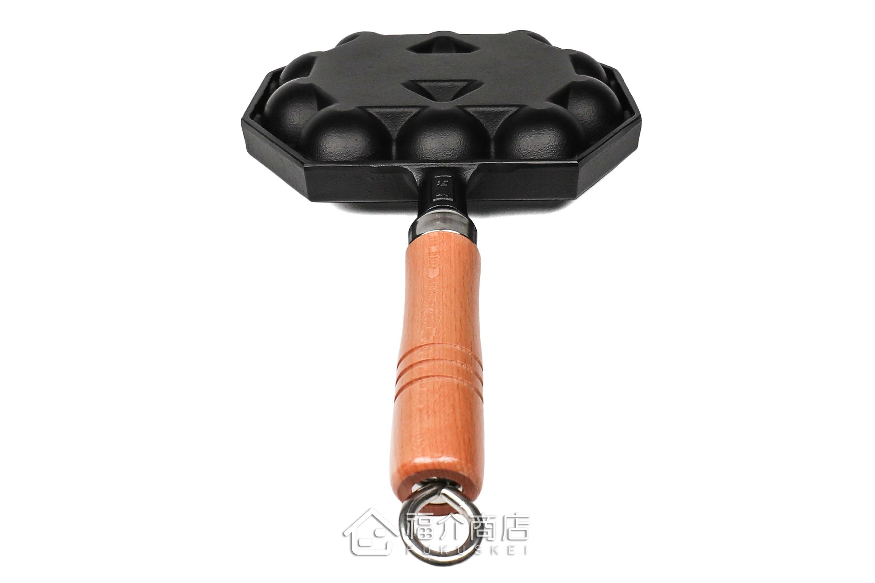 可以做14個章魚燒的黑色鑄鐵鍋有木柄把手