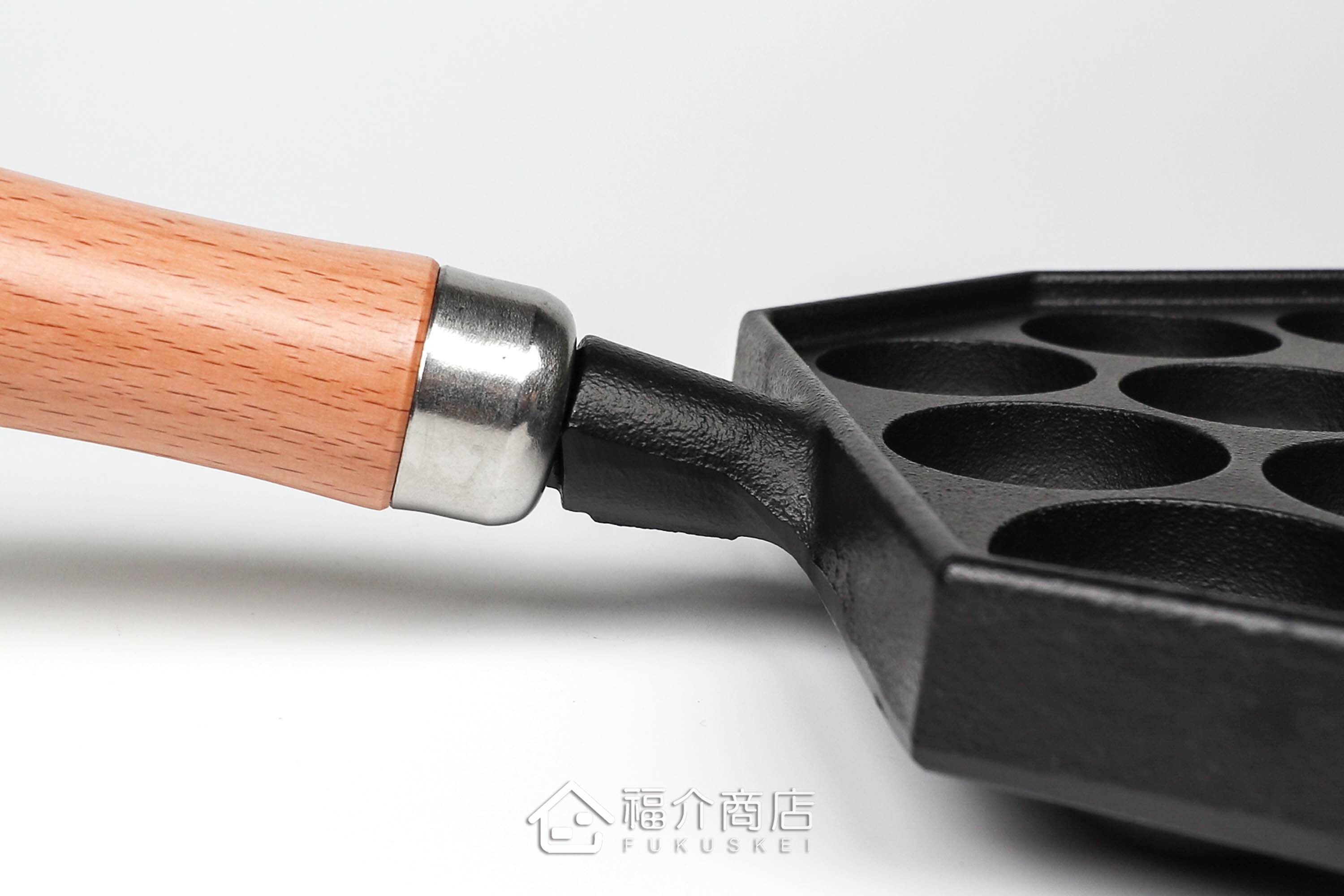 可以做14個章魚燒的黑色鑄鐵鍋有木柄把手