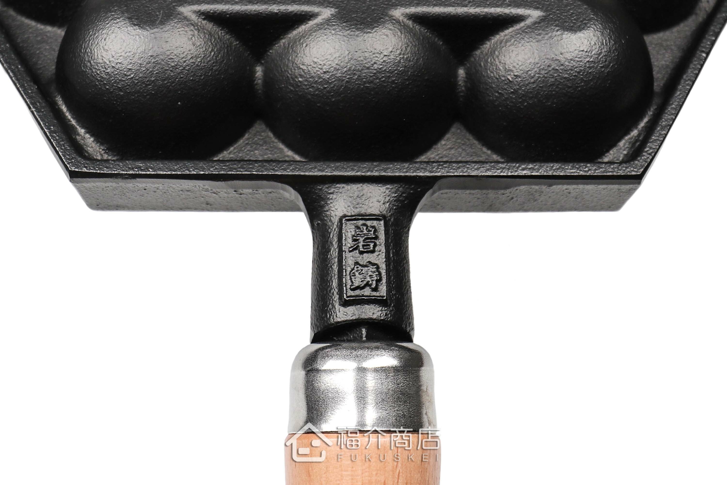 可以做14個章魚燒的黑色鑄鐵鍋有木柄把手