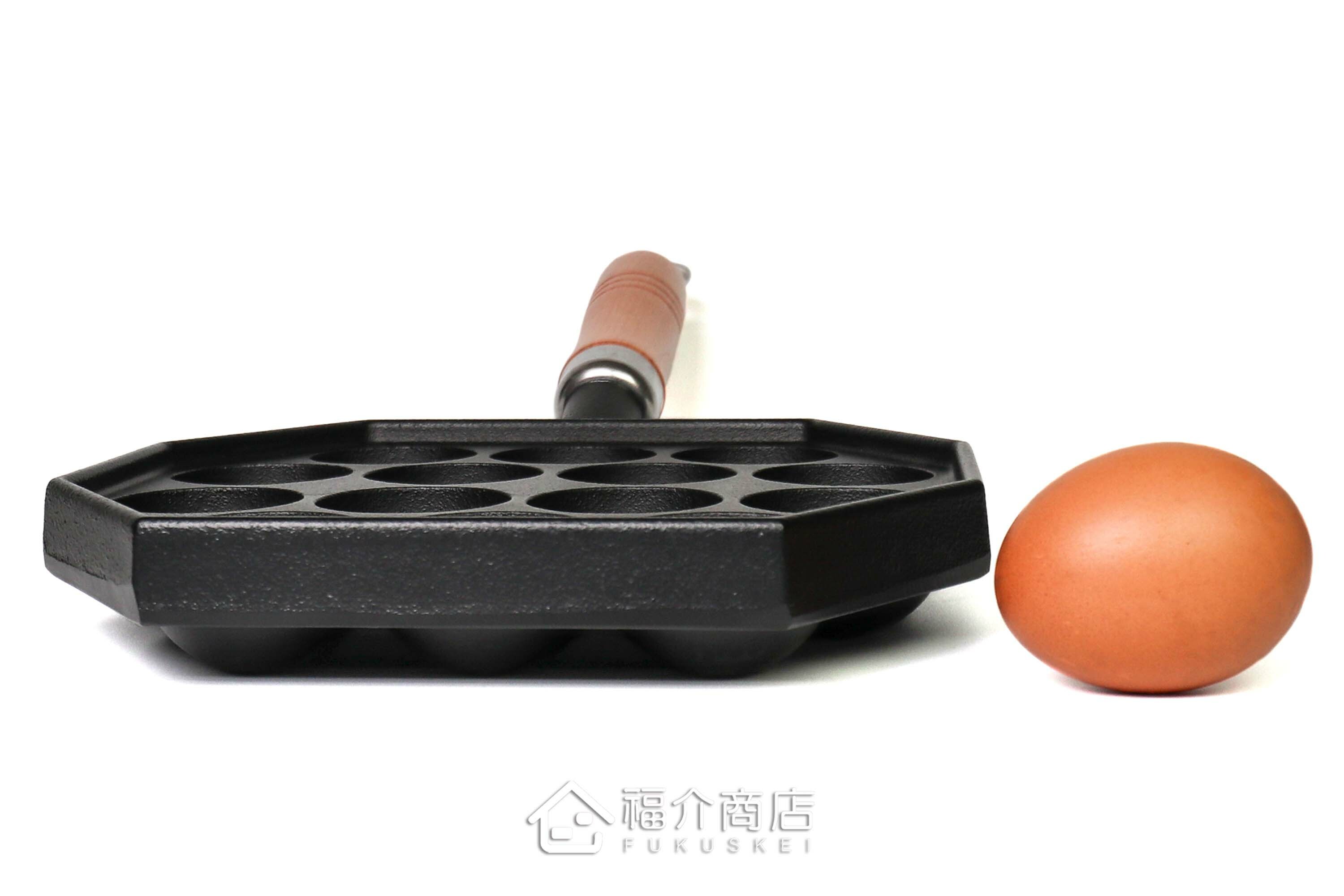 可以做14個章魚燒的黑色鑄鐵鍋有木柄把手