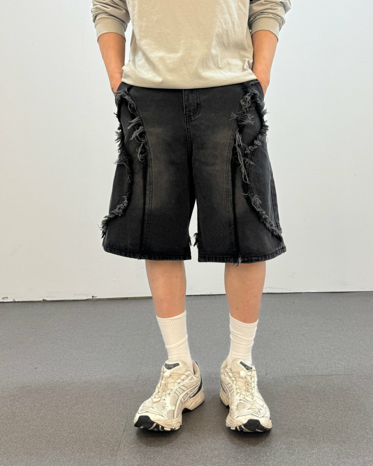 剪邊流蘇波浪剪裁水洗牛仔短褲