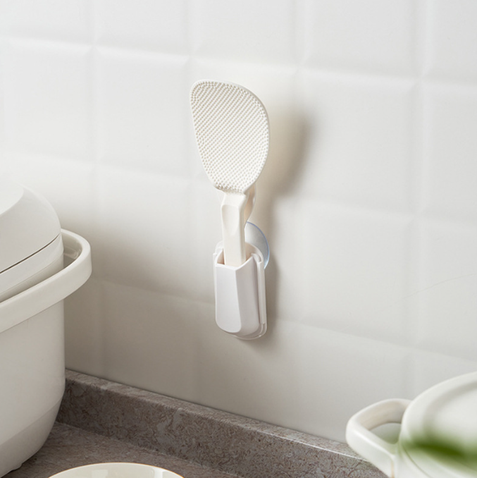 Suction cup type rice spoon storage rack