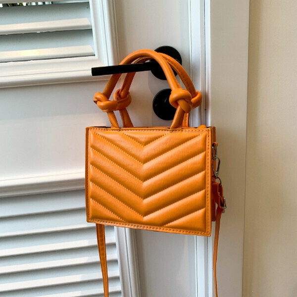 New solid color knotted handbag shoulder crossbody bag [orange]