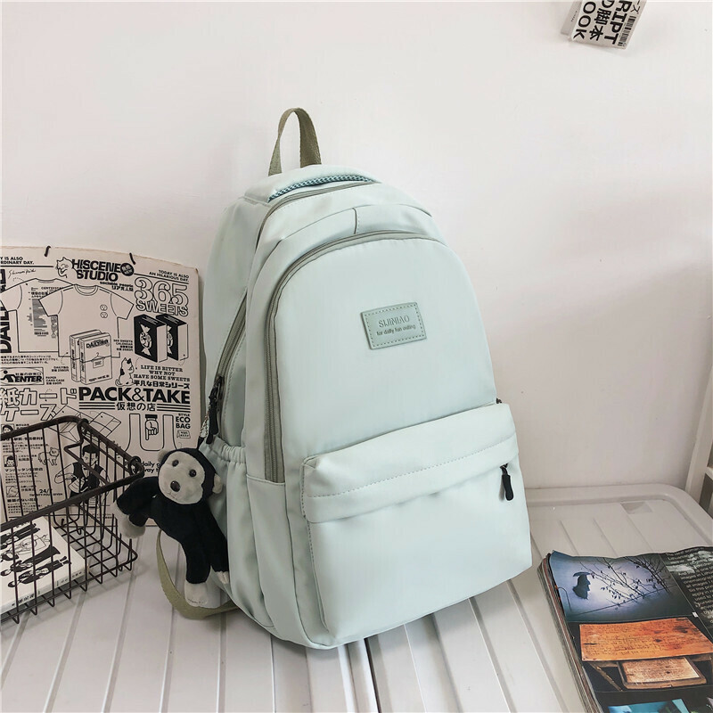 New large capacity travel outdoor backpack computer bag (green [with chimpanzee pendant])