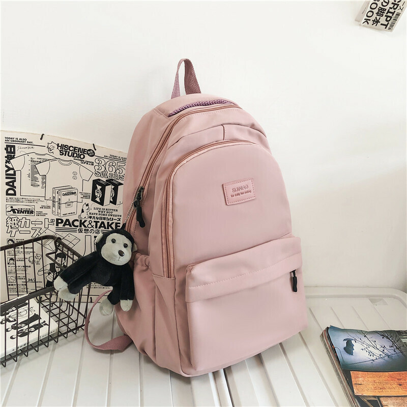 New large-capacity travel outdoor backpack and computer bag (pink [with chimpanzee pendant])