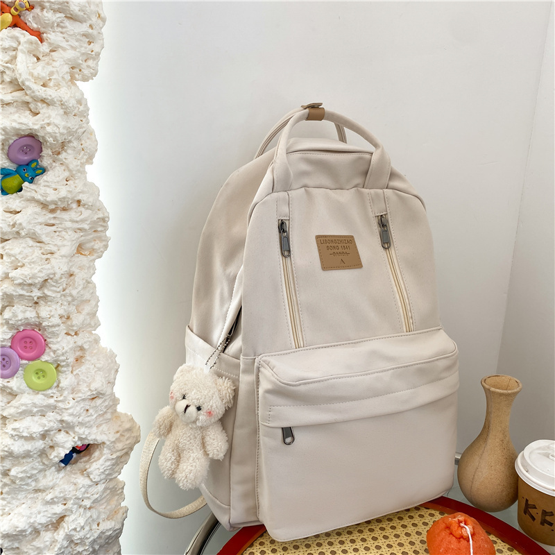 New large-capacity travel outdoor backpack computer bag (white [with blush bear pendant])