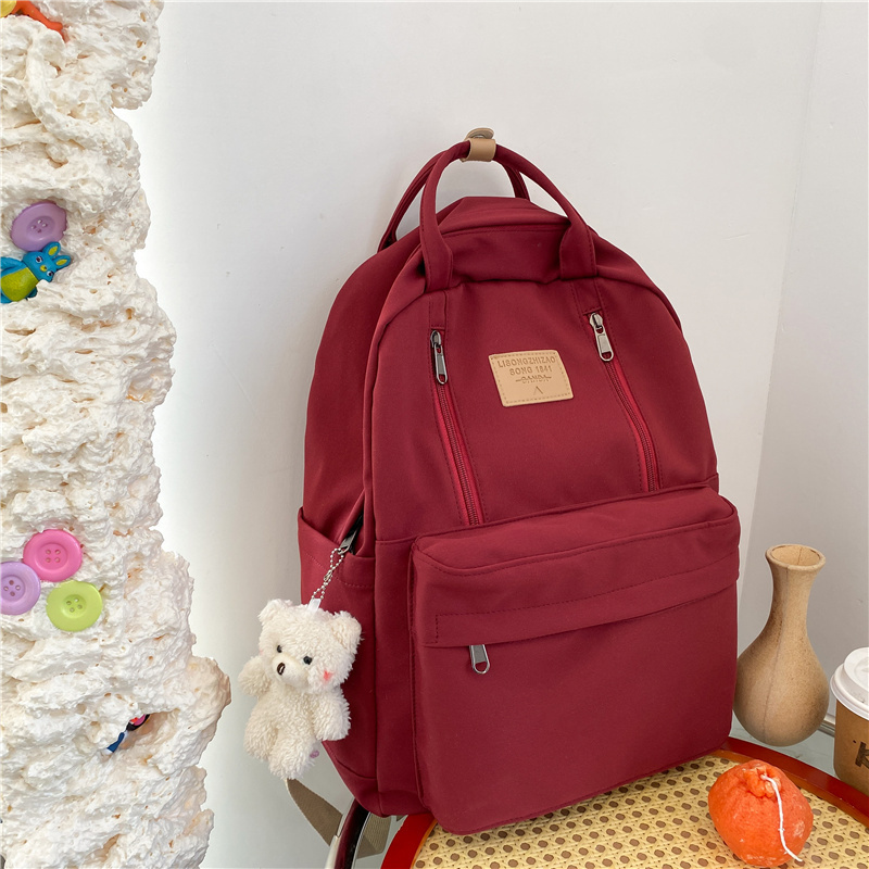 New large-capacity travel outdoor backpack computer bag (red [with blush bear pendant])