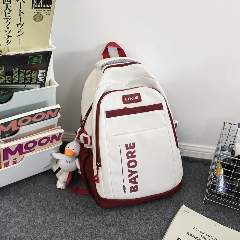 New large-capacity travel outdoor backpack and computer bag (white and red [with big white duck pendant])