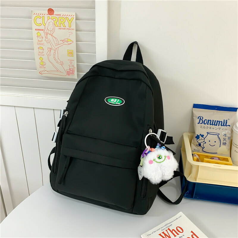 New large-capacity travel outdoor backpack and computer bag (black [with one-eyed pendant])