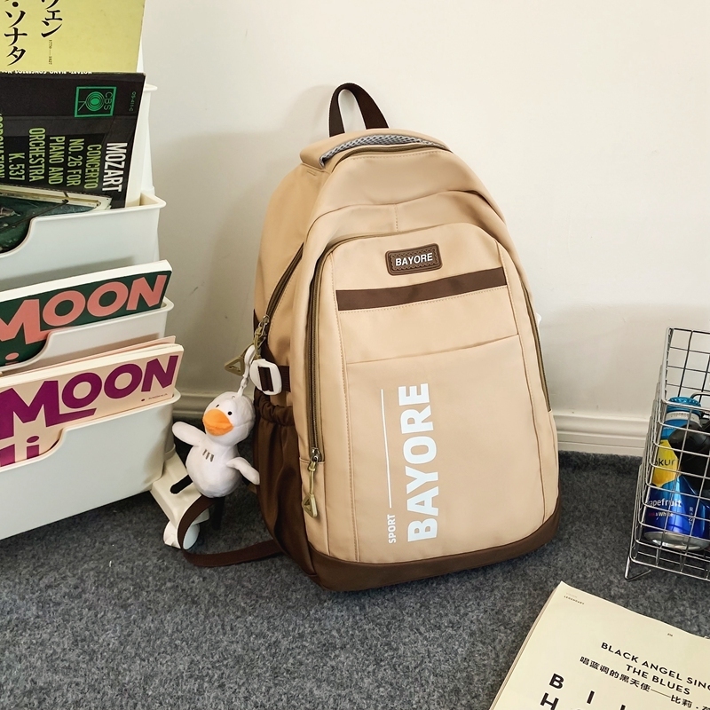 New large-capacity travel outdoor backpack and computer bag (khaki [with big white duck pendant])