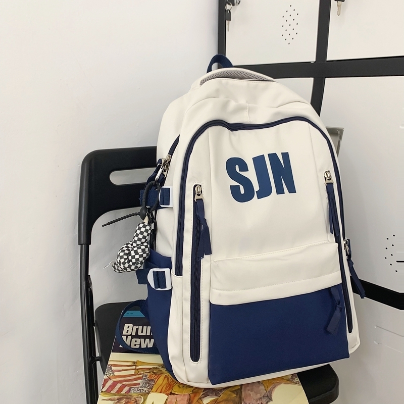 New large-capacity travel outdoor backpack computer bag (blue [with black and white checkered keychain pendant])