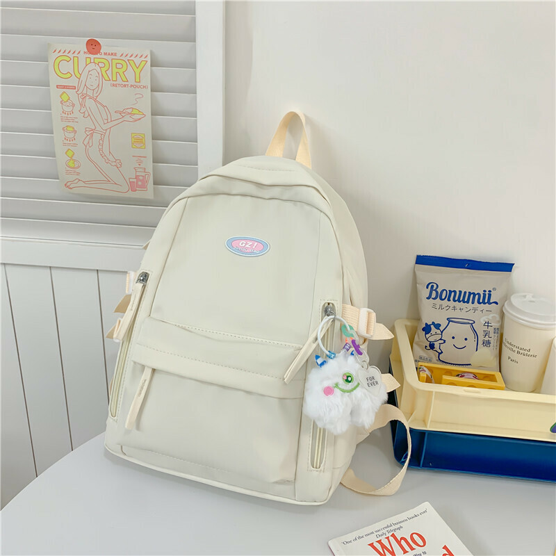 New large-capacity travel outdoor backpack and computer bag (off-white [with one-eyed pendant])