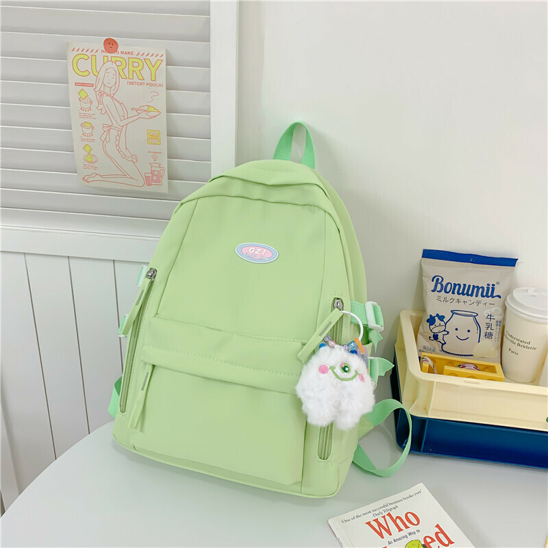 New large-capacity travel outdoor backpack computer bag (green [with one-eyed pendant])