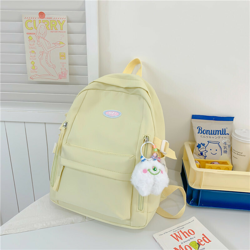 New large-capacity travel outdoor backpack and computer bag (beige [with one-eyed pendant])