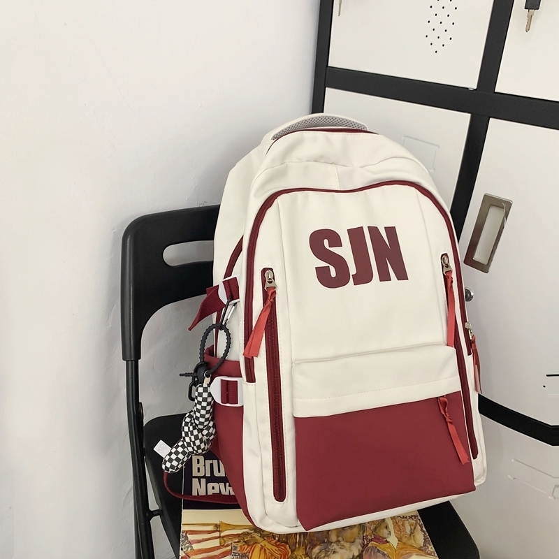 New large-capacity travel outdoor backpack and computer bag (red [with black and white checkered keychain pendant])