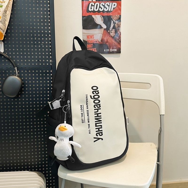 New large-capacity travel outdoor backpack computer bag (black [with big white duck pendant])