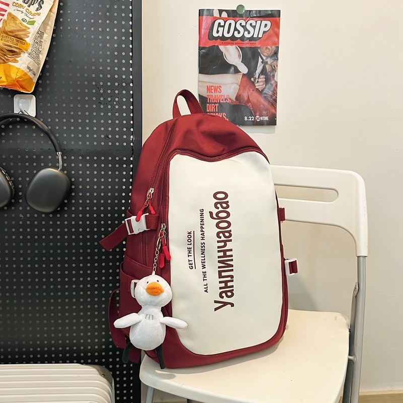 New large-capacity travel outdoor backpack and computer bag (red [with big white duck pendant])