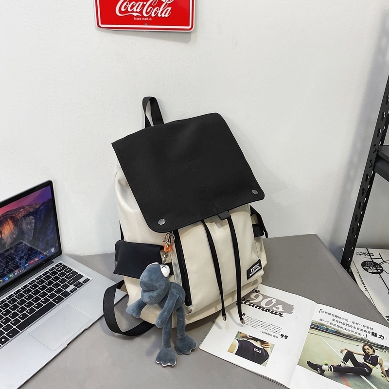 New large-capacity travel outdoor backpack and computer bag (black and white [with gray frog pendant])