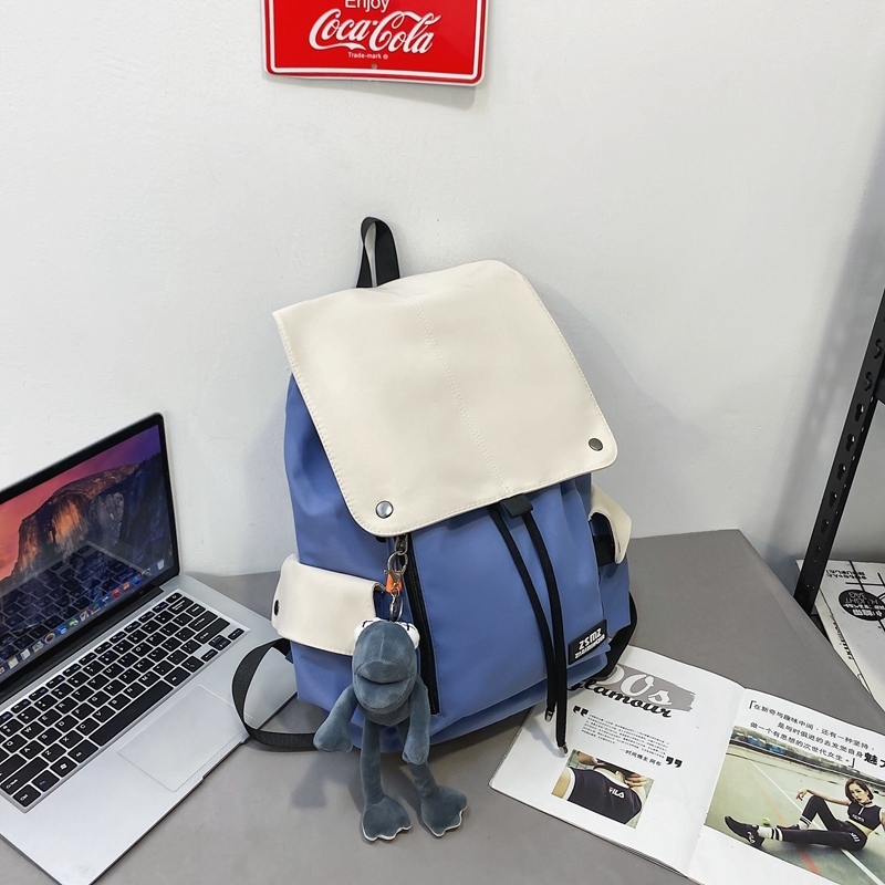 New large-capacity travel outdoor backpack and computer bag (blue and white [with gray frog pendant])