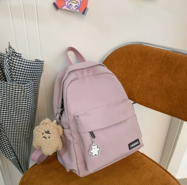 New simple and versatile small backpack for women (pink with brown fat star pendant + 1 badge)
