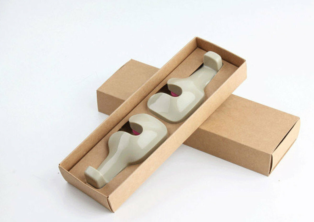A pair of multi-functional seatback headrest hooks for automobiles (beige style random).