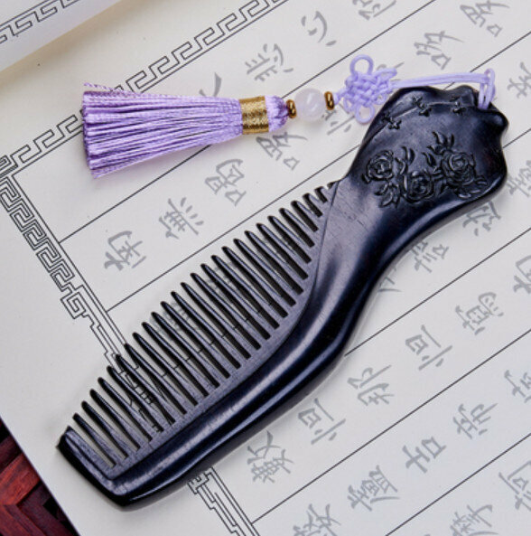 Hot ebony carved wood comb