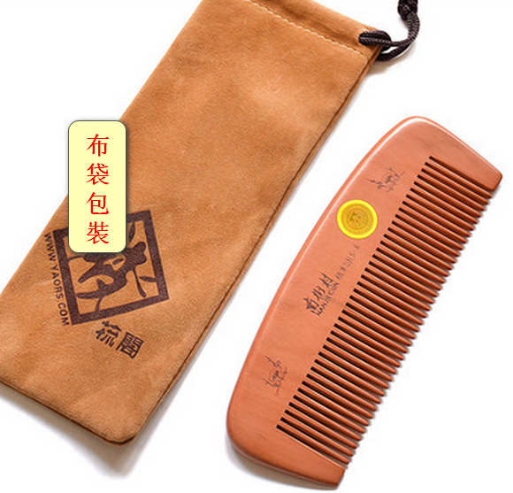 Hot-selling peachwood comb with dense teeth (total length of cloth bag packaging is 15 cm)