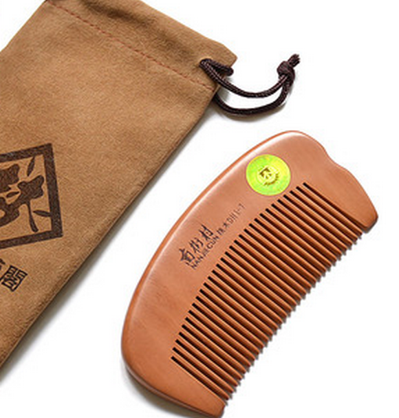 Popular natural peach wood comb (packaged in cloth bag) about 10.5 cm
